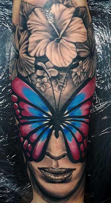 girl-with-butterfly-on-face-tattoo