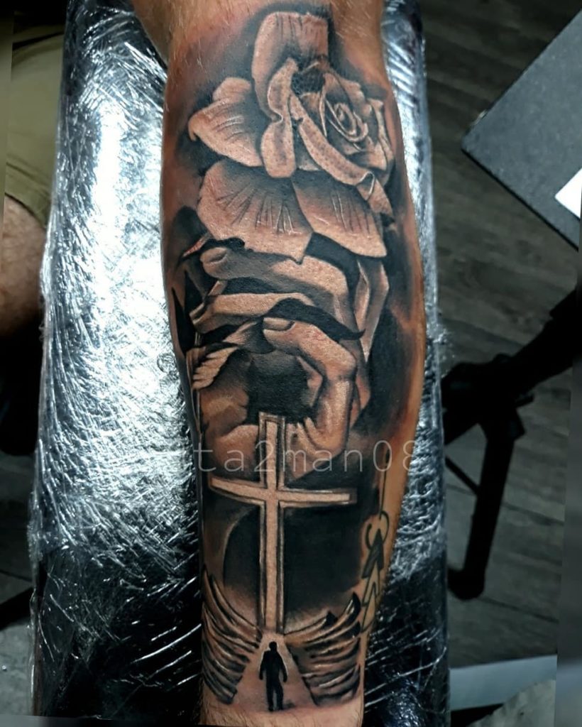 Black and grey tattoo rose and cross